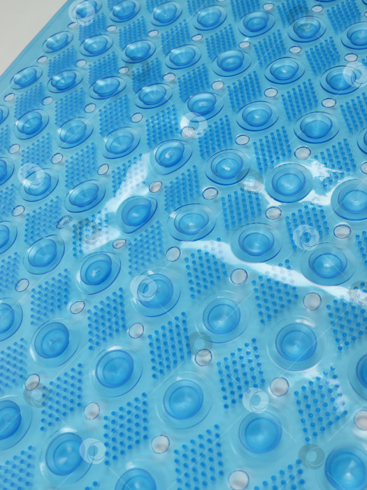 Скачать Голубой коврик для ванной из поливинилхлорида, вид с тыльной стороны крупным планом фотосток Ozero