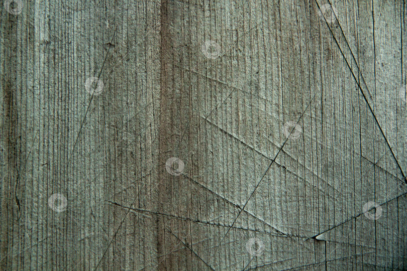 Скачать Старая деревянная поверхность с надрезами от ножа. Может использоваться в качестве фона с естественной текстурой фотосток Ozero