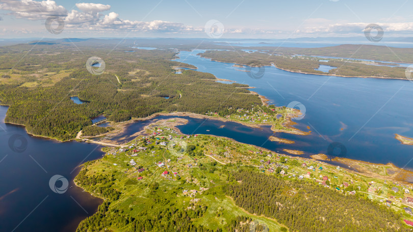Скачать Село Ковда, Россия - 06.2021: [Село Ковда и Никольская церковь с высоты] фотосток Ozero