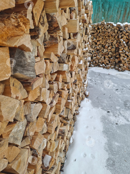 Скачать Колотые дрова в поленнице фотосток Ozero