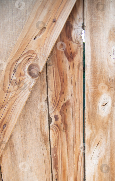 Скачать Фон выполнен из дерева с текстурой. Рисунок поверхности деревянного стола из деревянных досок, абстрактная текстура. фотосток Ozero