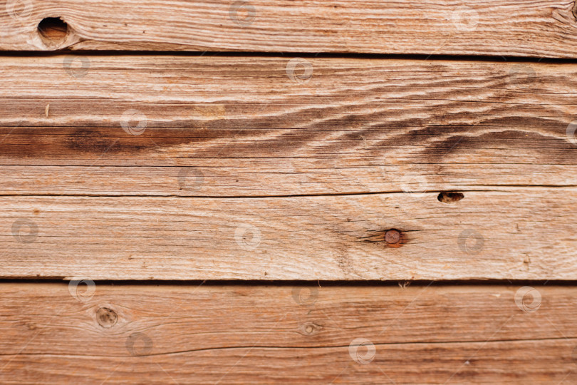 Скачать Фон выполнен из дерева с текстурой. Рисунок поверхности деревянного стола из деревянных досок, абстрактная текстура. фотосток Ozero