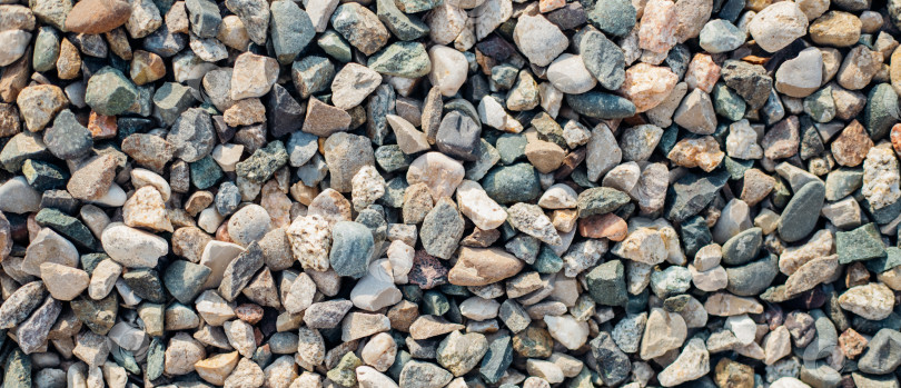 Скачать Фон выполнен из камней разных размеров и цветов. Фактура натуральных камней. фотосток Ozero