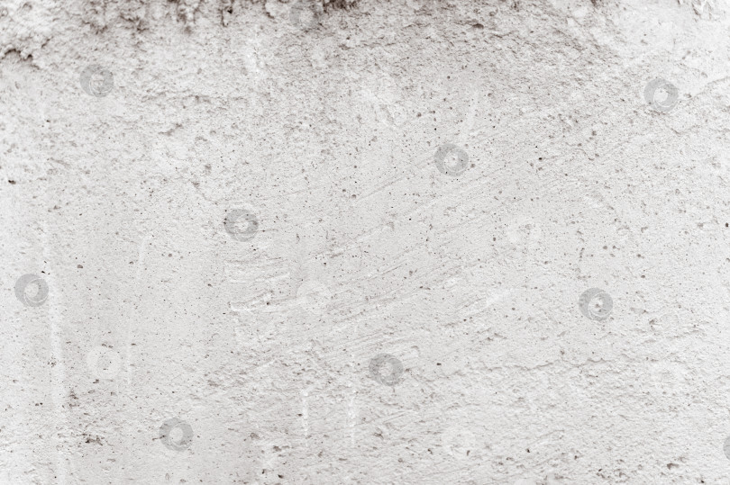 Скачать конкретный фон. текстура старой грязно-бело-серой шероховатой бетонной каменной стены в качестве фона. гранжево-серая цементная поверхность, похожая на структуру бумажного материала крупным планом фотосток Ozero