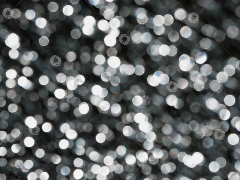 Скачать Круглые светящиеся бусины, боке на темно-черном фоне фотосток Ozero