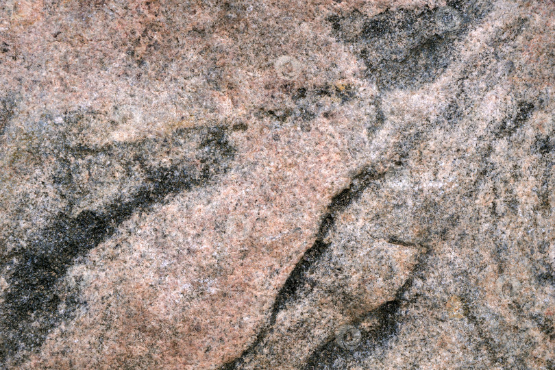 Скачать Фрагмент гранитного камня был сфотографирован крупным планом. фотосток Ozero