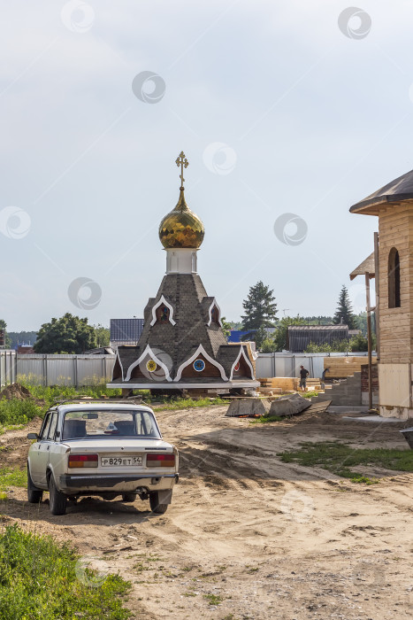 Скачать Строительство Богоявленского русского православного храма в Сибири. Деревянная конструкция фотосток Ozero