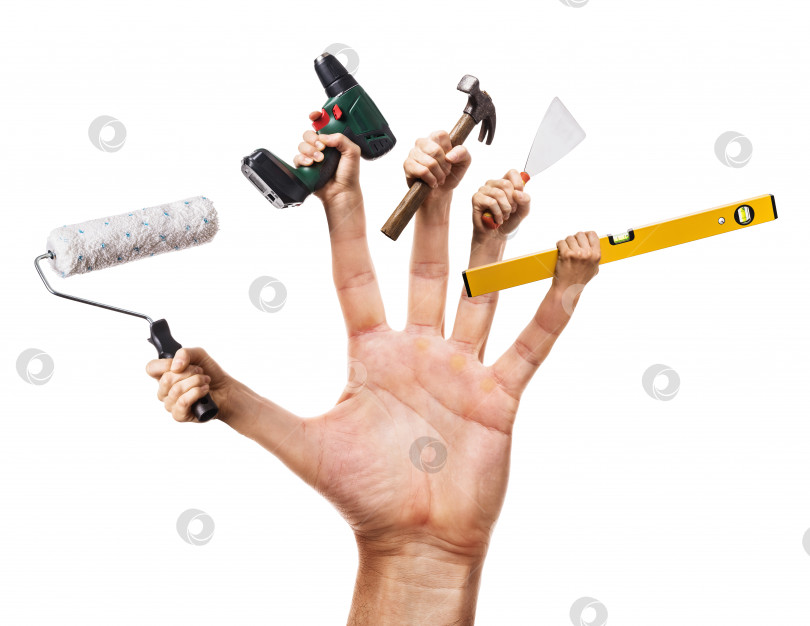 Скачать Рука держит различные строительные инструменты, выделенные на белом фоне. Концептуальный мастер на все руки фотосток Ozero