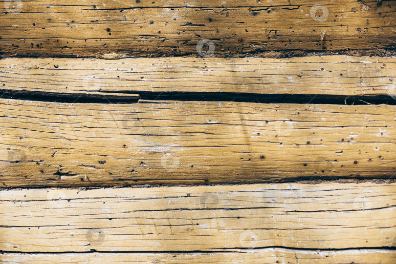 Скачать Текстура деревянной стены из старых бревен-фоновое изображение фотосток Ozero