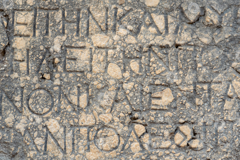 Скачать фон - полустертая античная надпись на камне в Фазелисе, Турция фотосток Ozero