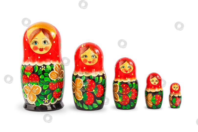 Скачать набор русских народных деревянных кукол, покрытых узорами, выделяющимися на белом фоне фотосток Ozero