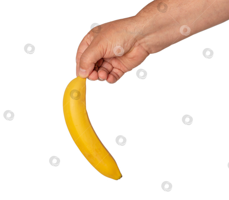 Скачать Свежий банан в мужской руке. фотосток Ozero