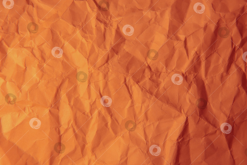 Скачать Скомканная оранжевая бумага. фотосток Ozero