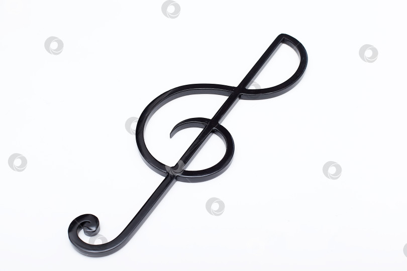 Скачать Черный скрипичный ключ на белом фоне. Музыкальный символ фотосток Ozero