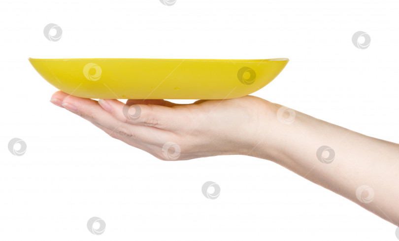 Скачать желтая пластина на женской руке на белом фоне фотосток Ozero