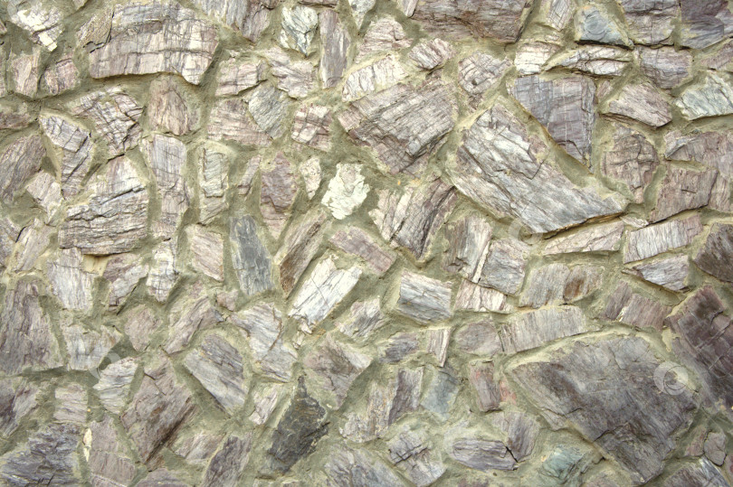 Скачать Фрагмент каменной стены из камней разного размера на цементной основе. фотосток Ozero