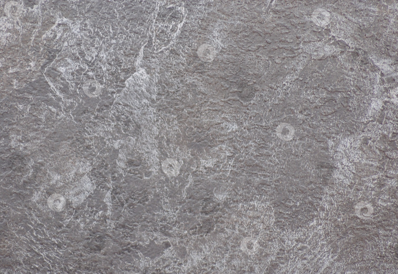 Скачать Грубо обработанная поверхность натурального серого камня крупным планом. фотосток Ozero