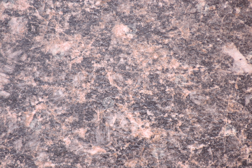 Скачать Черно-красный гранит, полированная поверхность натурального камня крупным планом. фотосток Ozero