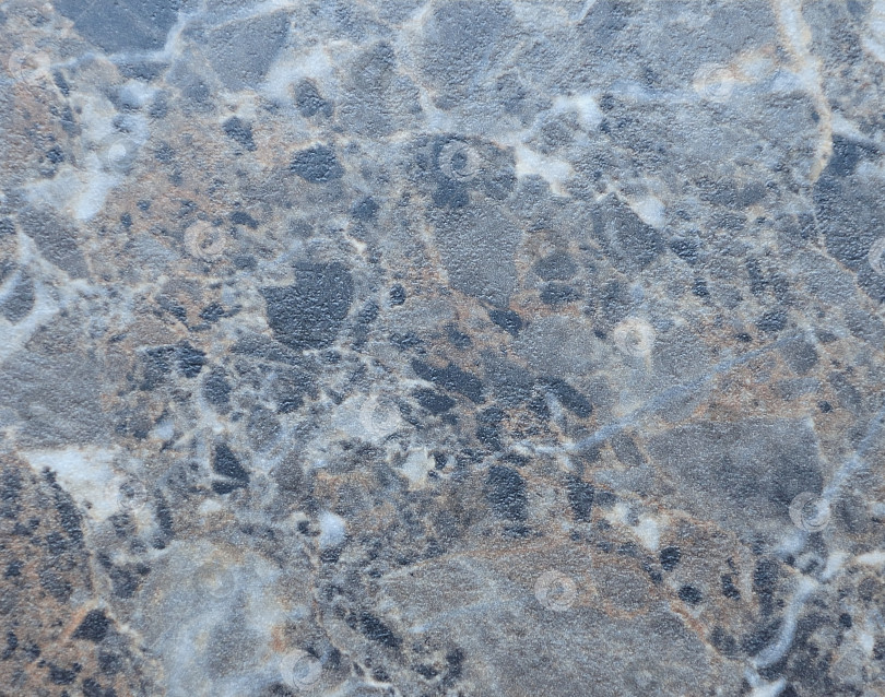 Скачать Бледно-коричневый мрамор с крупными вкраплениями белого и черного, крупный план текстуры натурального камня. фотосток Ozero