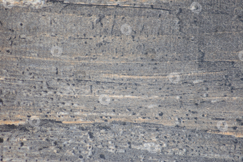 Скачать Фрагмент поверхности темно-серого камня со следами обработки. фотосток Ozero