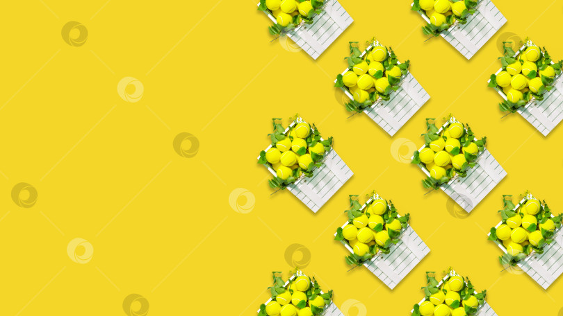 Скачать Теннисный фон с теннисными мячами в деревянных коробках на желтом фоне фотосток Ozero