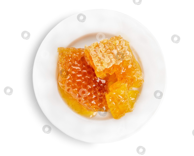 Скачать Свежие медовые соты на тарелке. фотосток Ozero