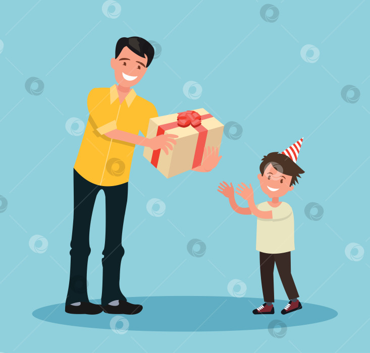 Скачать Детский день рождения. Отец дарит своему сыну подарок на день рождения. фотосток Ozero