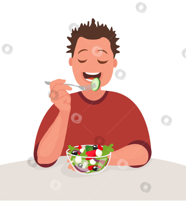 Скачать Мужчина ест салат. Вегетарианец. Концепция правильного питания и здорового образа жизни. фотосток Ozero