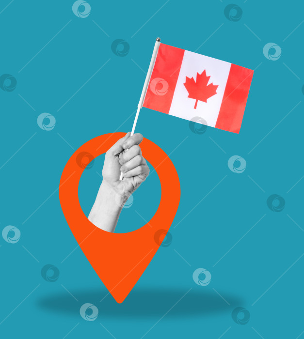 Скачать Художественный коллаж, коллаж из руки, держащей канадский флаг, со значком навигации на синем фоне. фотосток Ozero