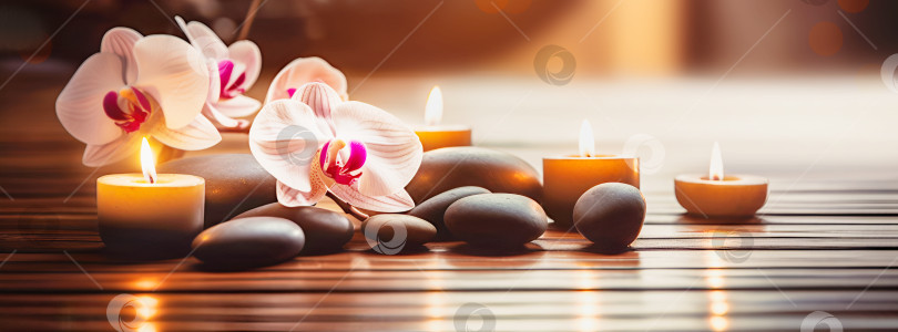 Скачать Красивая азиатская спа-композиция со свечами, орхидеями и массажными горячими камнями фотосток Ozero