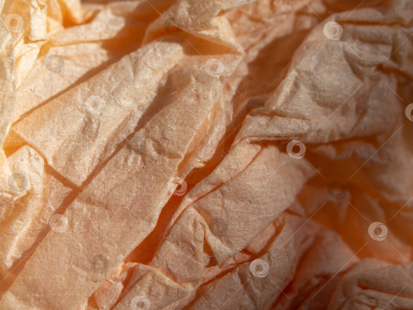 Скачать Текстура мятой бумаги персикового цвета для фона, мягкого фокуса фотосток Ozero