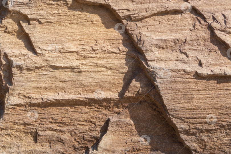 Скачать Фон с текстурой камня. Макрофотографический узор неровная текстурированная поверхность теплого камня фотосток Ozero