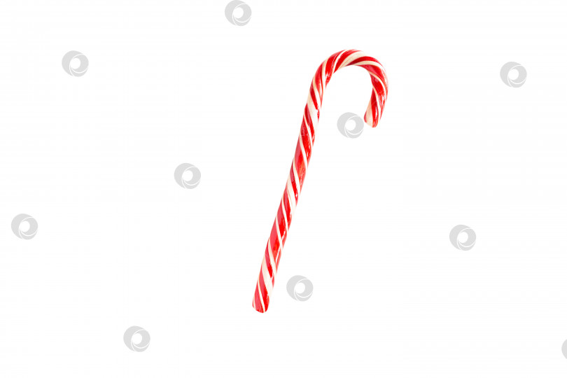 Скачать Рождественская конфета - полосатая трость Санты на белом фоне, изолят. Закрыть. Рождество, новый год. Украшения, сладости, карамель, угощения для детей фотосток Ozero