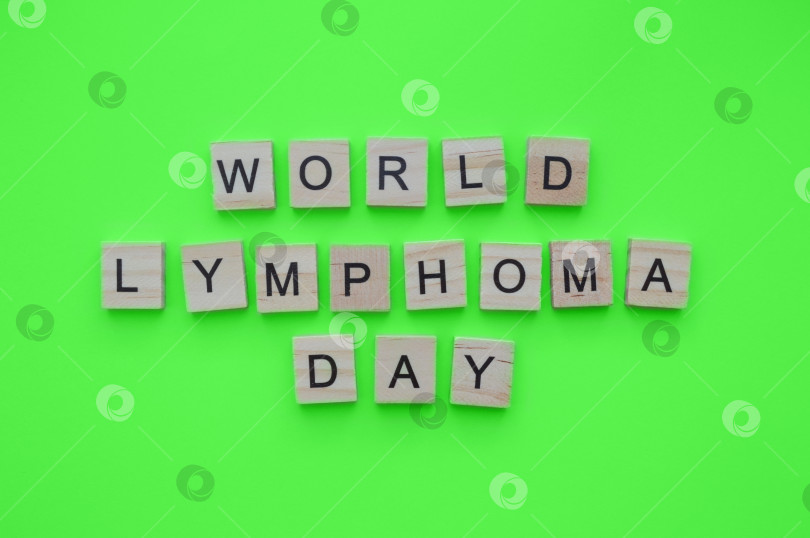 Скачать September 15, World Lymphoma Awareness Day, minimalistic banner with the inscription in wooden letters фотосток Ozero