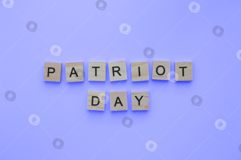 Скачать September 11, Patriot Day, minimalistic banner with the inscription in wooden letters фотосток Ozero