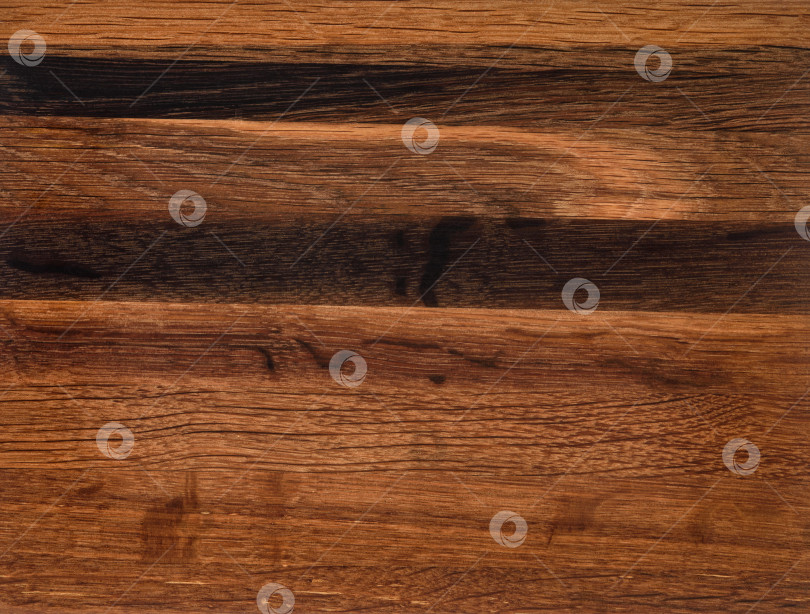 Скачать Brown Beige Texture of stained oak wood with grain, fragment of a wooden panel hardwood. surface bark is used as natural background, web page, board, table. Contrasts and symmetries. Space for text. фотосток Ozero