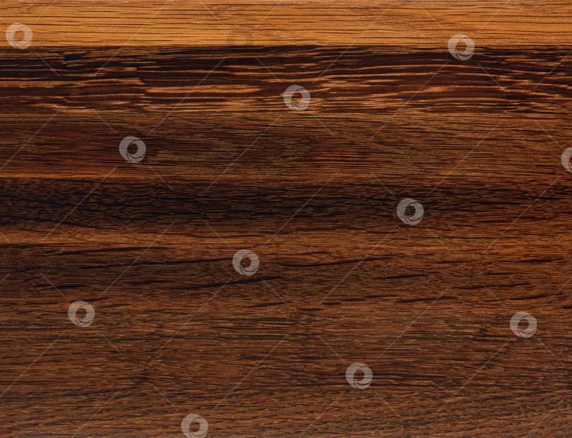 Скачать Brown Beige Texture of stained oak wood with grain, fragment of a wooden panel hardwood. surface bark is used as natural background, web page, board, table. Contrasts and symmetries. Space for text. фотосток Ozero