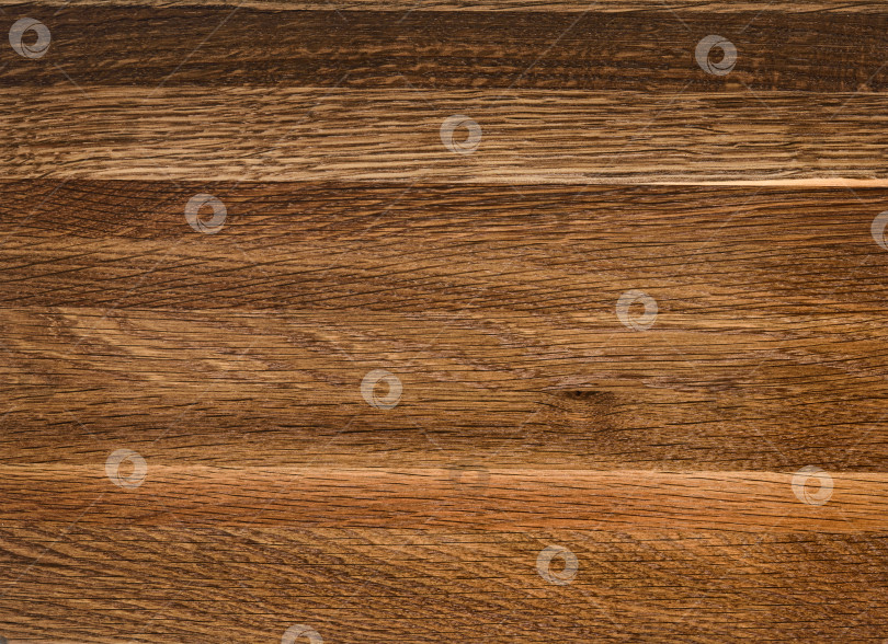 Скачать Brown Beige Texture of stained oak wood with grain, fragment of a wooden panel hardwood. surface bark is used as natural background, web page, board, table. Contrasts and symmetries. Space for text. фотосток Ozero