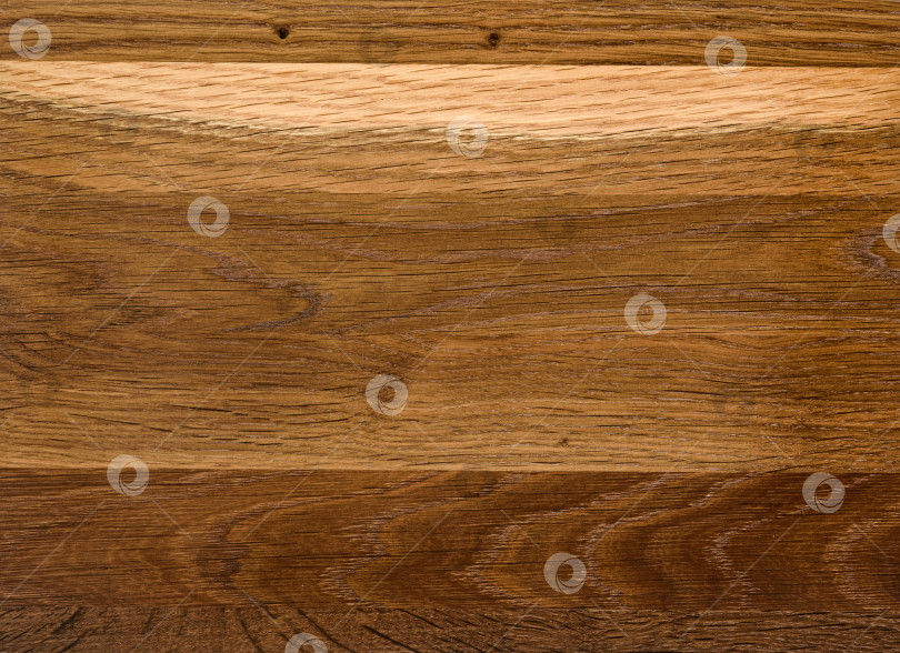 Скачать Brown Beige Texture of stained oak wood with grain, fragment of a wooden panel hardwood. surface bark is used as natural background, web page, board, table. Contrasts and symmetries. Space for text. фотосток Ozero