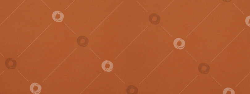 Скачать The texture of the dark orange color of the paper as a background. Orange paper background for the banner фотосток Ozero