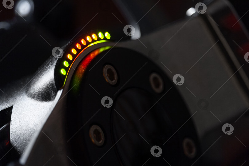 Скачать Close up view on a racing steering wheel with RPM LED  indicators фотосток Ozero