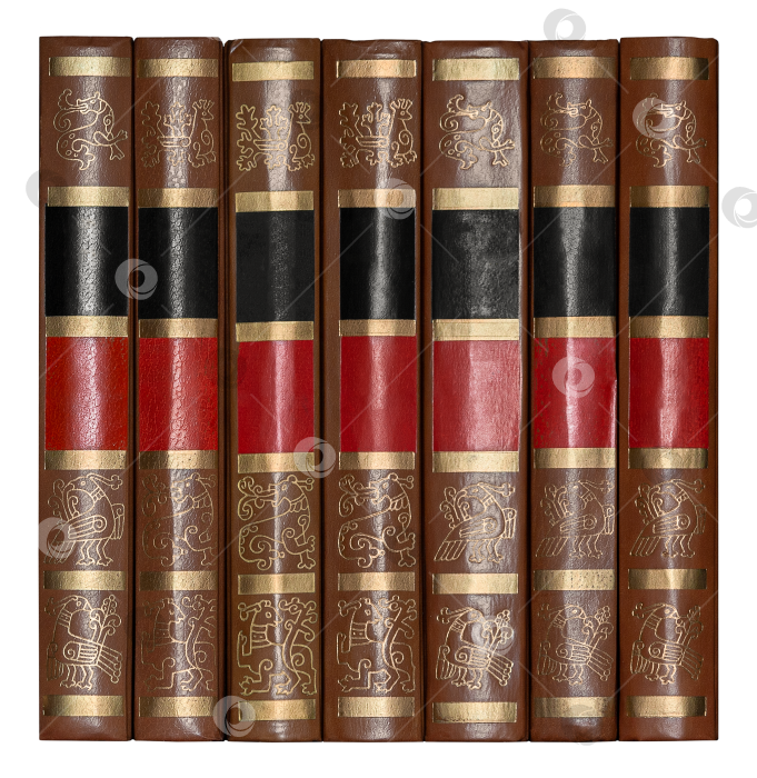 Скачать A row of antique books with leather hardcover, isolated on a white background фотосток Ozero