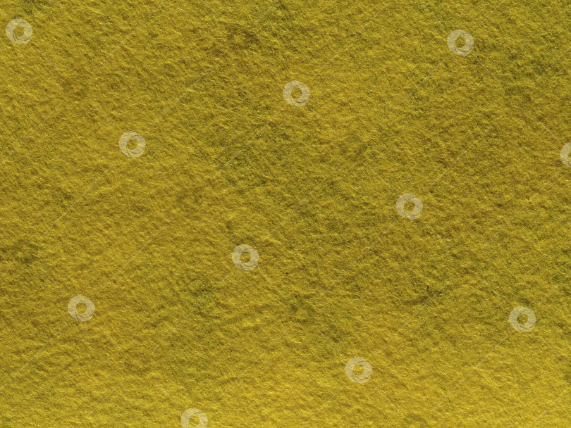 Скачать текстура фона из желтого войлока. Текстура темно-желтого ворса из шерсти или синтетического войлока. Фетровая ткань с тонким ворсом макросъемка фотосток Ozero