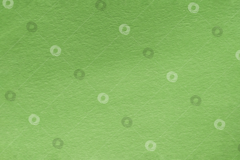 Скачать Текстурированный фон из зеленой крафт-бумаги. Фон с текстурой обычной бумаги с зелеными градиентами. зеленый бумажный фон в стиле ретро. Винтажная картонная текстура фотосток Ozero