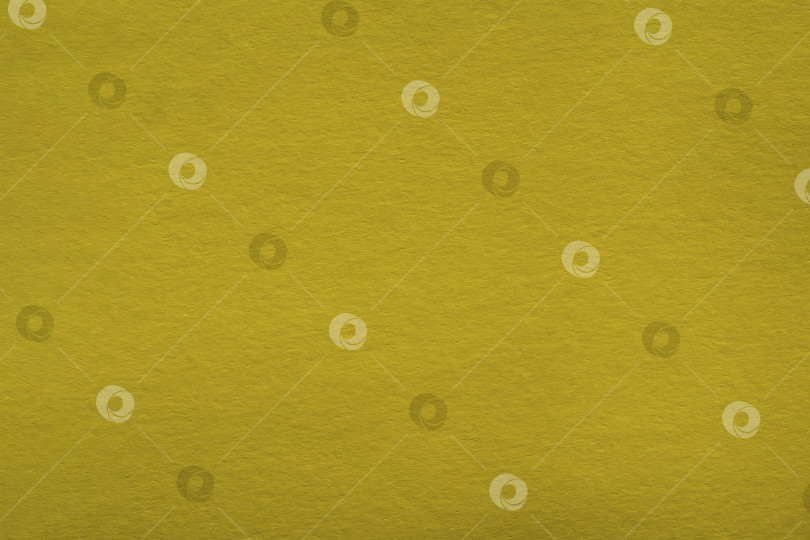 Скачать Макро-желтая бумага с видимой текстурой. Текстурированный фон из желтой картонной бумаги. Желтый бумажный фон фотосток Ozero
