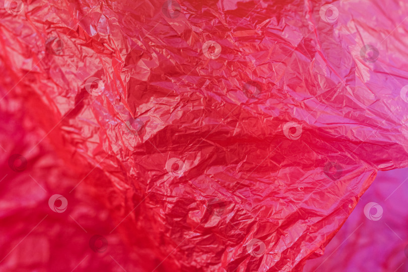 Скачать Текстура красного мятого пластикового пакета фотосток Ozero