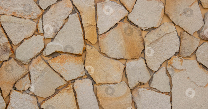 Скачать Стены из натурального камня. Бежевый текстурированный фон для стен в дизайне интерьера фотосток Ozero