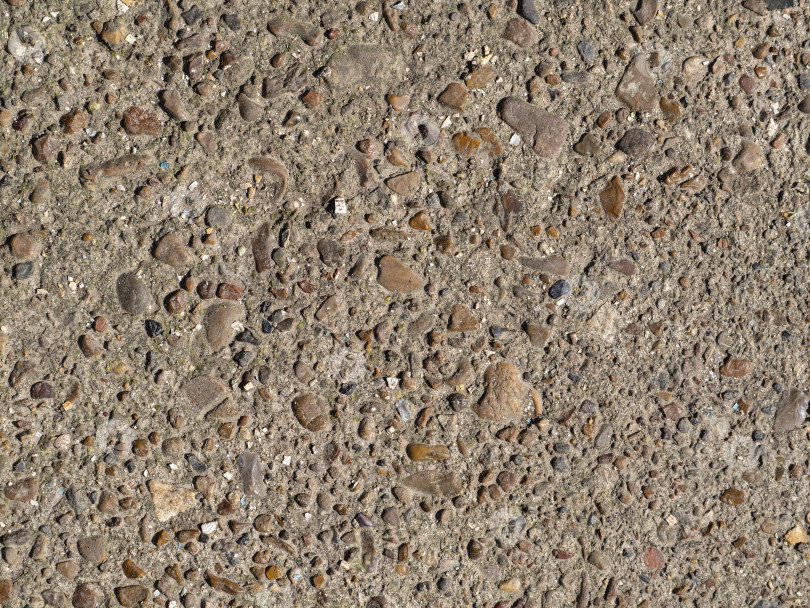 Скачать Текстурная деталь бетонной поверхности с мелкой галькой из гравия представляет собой абстрактный фон. Разноцветная галька, залитая цементным раствором. Текстурированный фон строительной поверхности фотосток Ozero