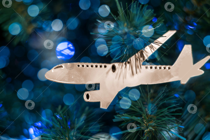 Скачать Украшение для рождественской елки в виде серебряного самолетика фотосток Ozero