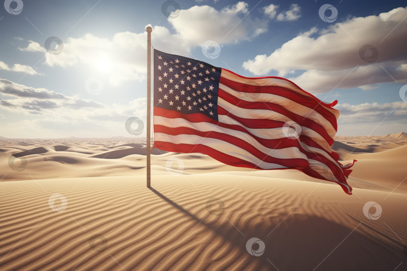 Скачать Развевающийся американский флаг на шесте в песках пустыни в солнечный день фотосток Ozero
